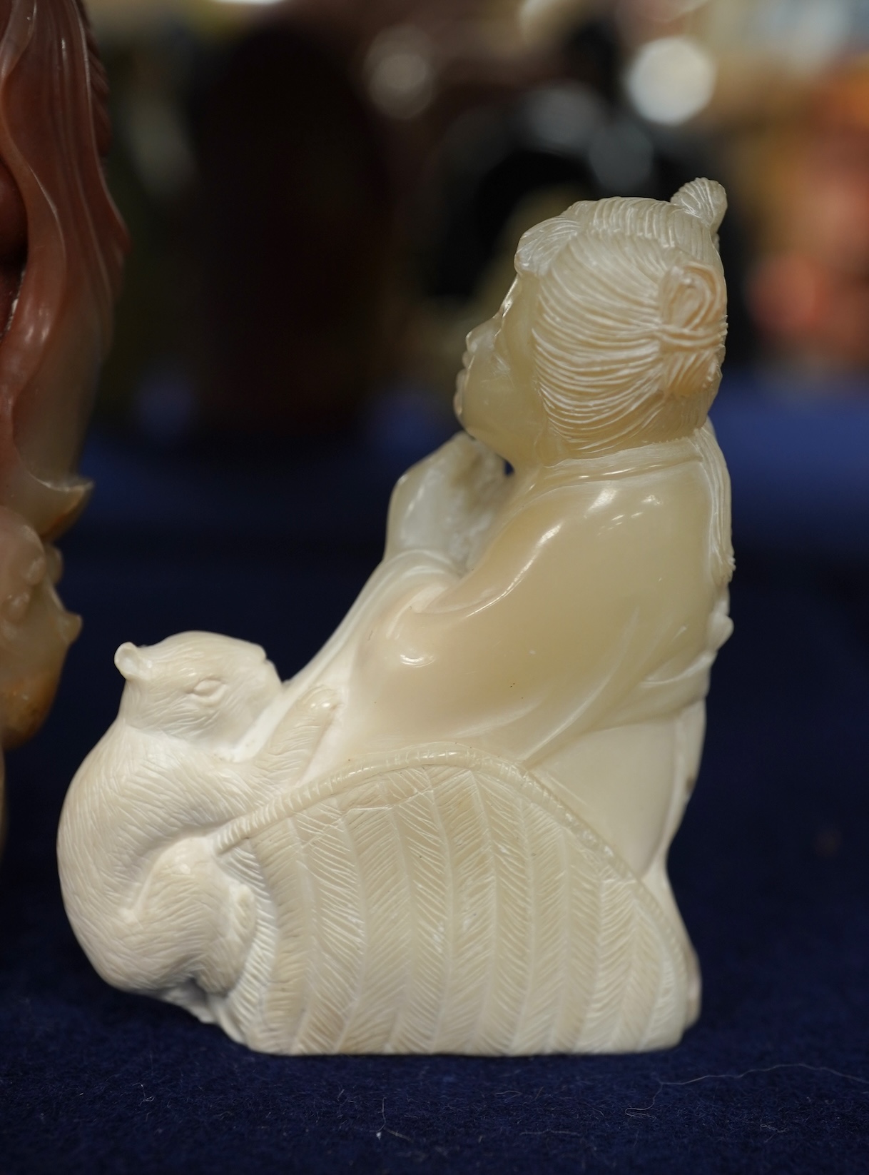 A Chinese white jade 'boys with jar' carving and three shoushan stone figures; luohan, girl with squirrel and mermaid (4), tallest 11cm
